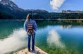 Young woman admires beautiful panorama of Black Lake ( Crno jezero),Durmitor, Montenegro Royalty Free Stock Photo