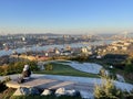 Vladivostok, Russia, October, 12, 2022. Young woman admires the city of Vladivostok from the observation deck in the Upland Park o