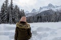 A young woman admiring the snowy views of Island Lake in Fernie, British Columbia, Canada.The majestic winter background is pretty Royalty Free Stock Photo