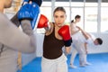 Young woman training in boxing fight in studio Royalty Free Stock Photo