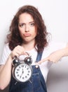 Young woman with alarmclock