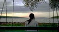 Young woman alone viewing lake Royalty Free Stock Photo