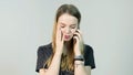 Young woman angry, cry, confused, sad, nervous, upset, stress and thinking with her mobile phone, beautiful young girl Royalty Free Stock Photo