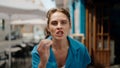 Young woman angry standing at street