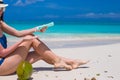 Young woman apply cream on her smooth tanned legs Royalty Free Stock Photo