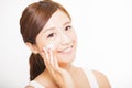 young woman applying cosmetic cream on her face Royalty Free Stock Photo