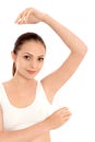 Young woman applying deodorant Royalty Free Stock Photo