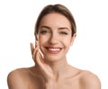 Young woman applying facial cream on white background Royalty Free Stock Photo