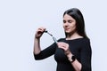 Young woman applying mascara on her eyelashes, on white background Royalty Free Stock Photo