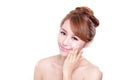 Young woman applying moisturizer cream on face Royalty Free Stock Photo