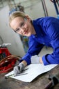 Young woman apprentice in plumbery