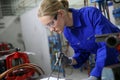 Young woman apprentice in plumbery Royalty Free Stock Photo