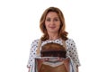 Young woman in apron holding a spelt sourdough homemade bread, isolated on white background