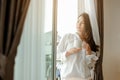 Young woman asia living at home relaxing and reading a book in the bedroom on holiday Royalty Free Stock Photo