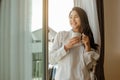 Young woman asia living at home relaxing and reading a book in the bedroom on holiday Royalty Free Stock Photo