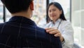 young woman Asian doctor patient, patting shoulder with care, support, sympathy, hope, giving comfort, empathy, asking Royalty Free Stock Photo