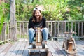 Young woman asian she rides a toy wood horse on the carousel wit Royalty Free Stock Photo