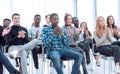 young woman asks a question at a business seminar. Royalty Free Stock Photo