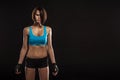 Young woman athlet muscle body portrait in gym Royalty Free Stock Photo