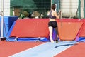 young woman athlete performs the high jump pole vault Royalty Free Stock Photo