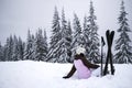 Young woman athlete posing on skis on a mountain slope. professional sportsman is skiing. winter sport Royalty Free Stock Photo