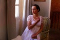 Regency reenactment by young woman in lace dress