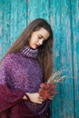 Portrait of a pretty young teenage girl 13-16 years old. Young woman with autumn flowers closeup Royalty Free Stock Photo