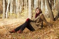 Young fashion blond woman in autumn forest Royalty Free Stock Photo