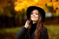 Young woman with autumn leaves in hand and fall yellow maple gar Royalty Free Stock Photo