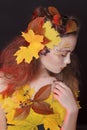 Young woman with autumn make up and leaves on head Royalty Free Stock Photo