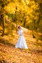 Young woman in a autumn park. Lady with a leafs Royalty Free Stock Photo