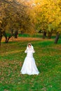 Young woman in a autumn park. Lady with a leafs Royalty Free Stock Photo