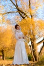 Young woman in a autumn park. Lady with a leafs Royalty Free Stock Photo