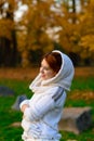 Young woman in a autumn park. Lady with a leafs Royalty Free Stock Photo