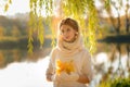 Young woman in a autumn park. Lady with a leafs Royalty Free Stock Photo