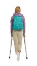 Young woman with axillary crutches on white background, back view