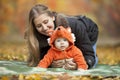 Young woman with baby dressed in fox costume