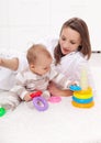 Young woman with baby girl playing Royalty Free Stock Photo