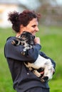 Young woman with baby goat outdoor Royalty Free Stock Photo