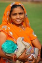 Young woman with a baby standing in Agra Fort, Uttar Pradesh, In
