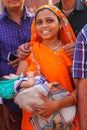 Young woman with a baby standing in Agra Fort, Uttar Pradesh, In