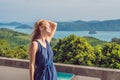 Young woman in the background of Tropical beach landscape panorama. Beautiful turquoise ocean waives with boats and sandy coastlin Royalty Free Stock Photo