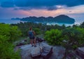 Female Backpacker admires beautiful landscape of the Ko Phi Phi after sunset, Thailand
