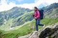 Woman descends the rocky terrain. Fagaras Mountains, Romania Royalty Free Stock Photo