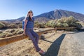 Young woman with backpack resting near Teide Royalty Free Stock Photo