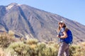 Young woman with backpack standing near Teide Royalty Free Stock Photo