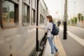 Young woman with backpack take the train