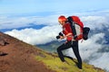 Young woman with backpack trekking on Pico volcano. Royalty Free Stock Photo