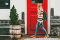 Young woman with backpack walking in city