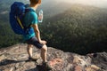 woman backpacker enjoy the view on mountain peak Royalty Free Stock Photo